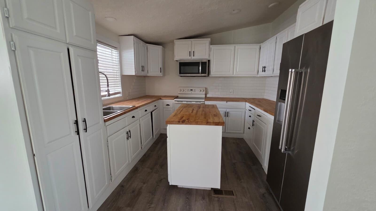 White cabinetry & butcher block — 1450 N Dixie Downs Rd #51, St. George, UT 84770
