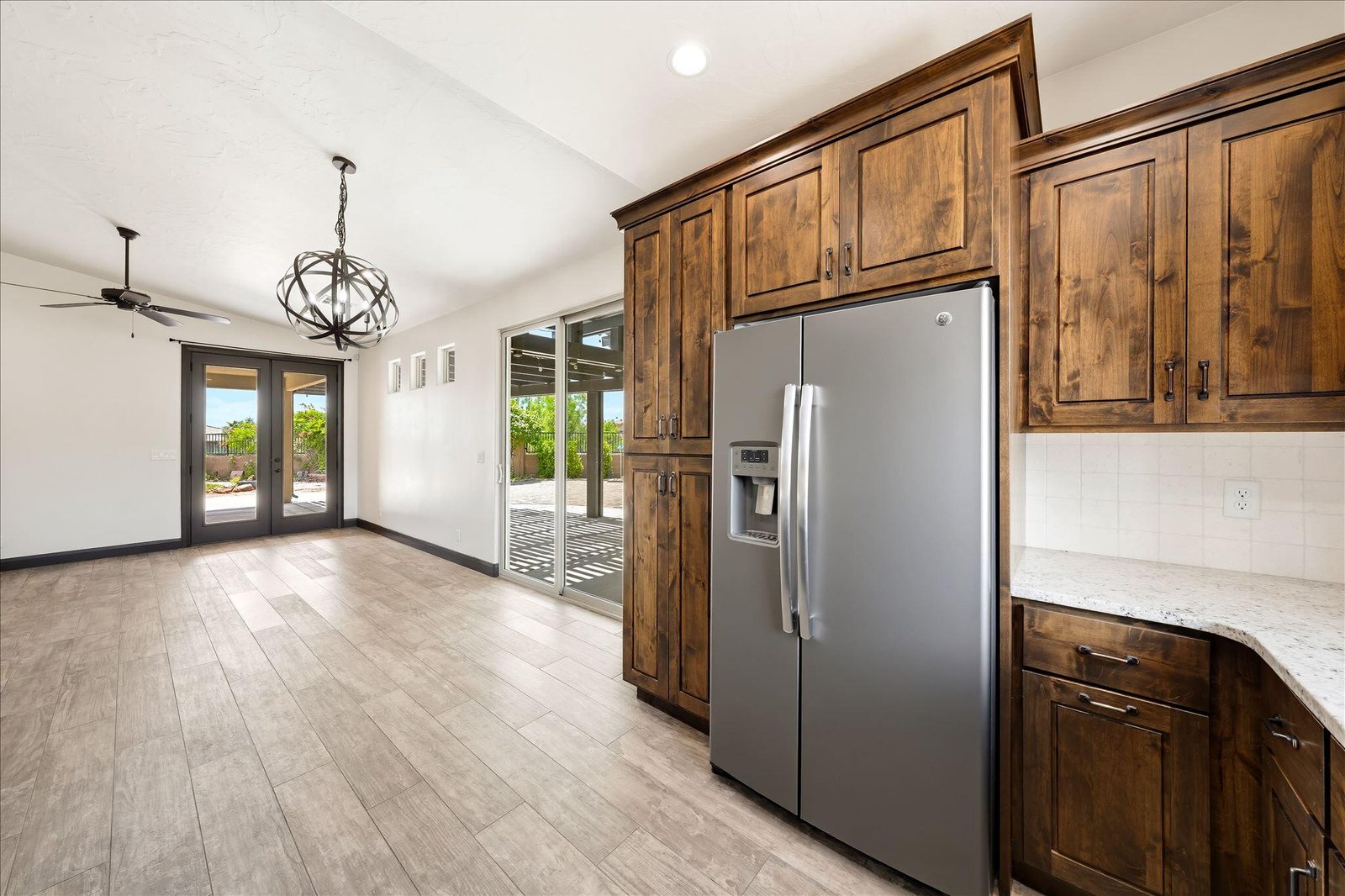 Open kitchen with stainless appliances — 313 W Peridot Dr, Washington, UT 84780