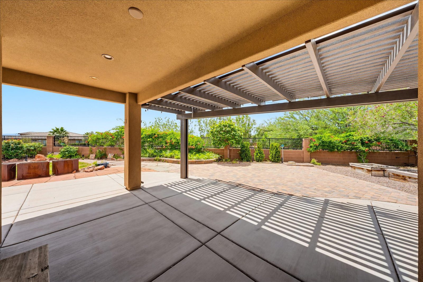 Covered patio for shade & entertaining — 313 W Peridot Dr, Washington, UT 84780